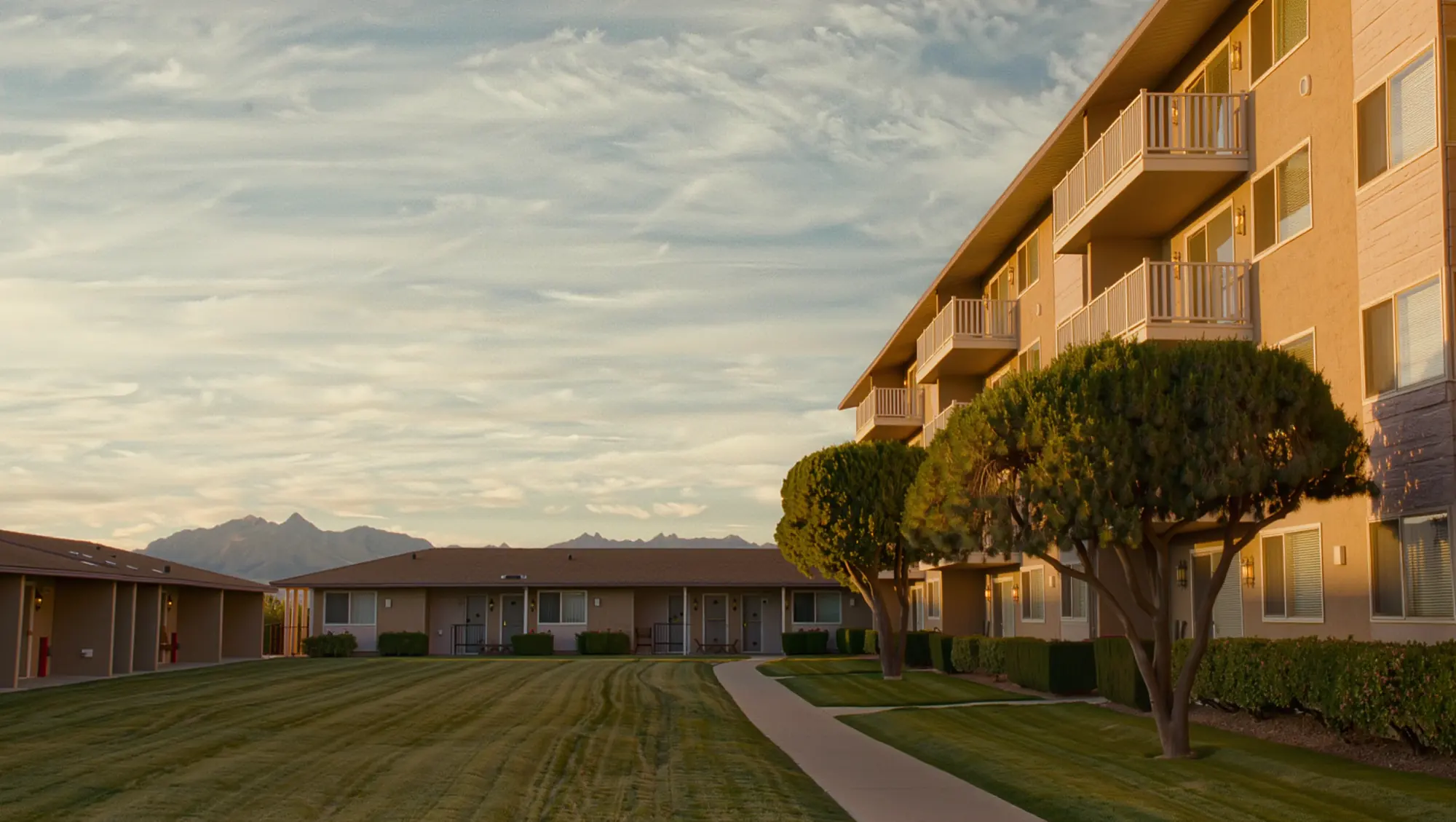 A Utah apartment complex courtyard at golden hour
