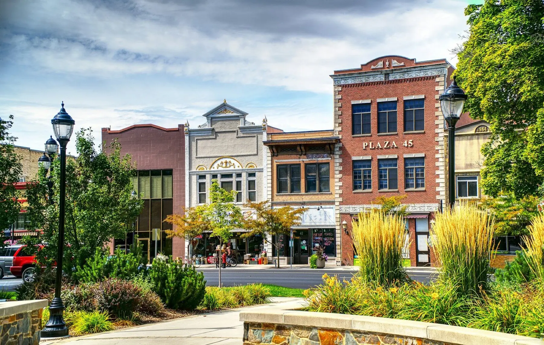 A historic commercial main street in Utah, with brick storefronts and street lamps